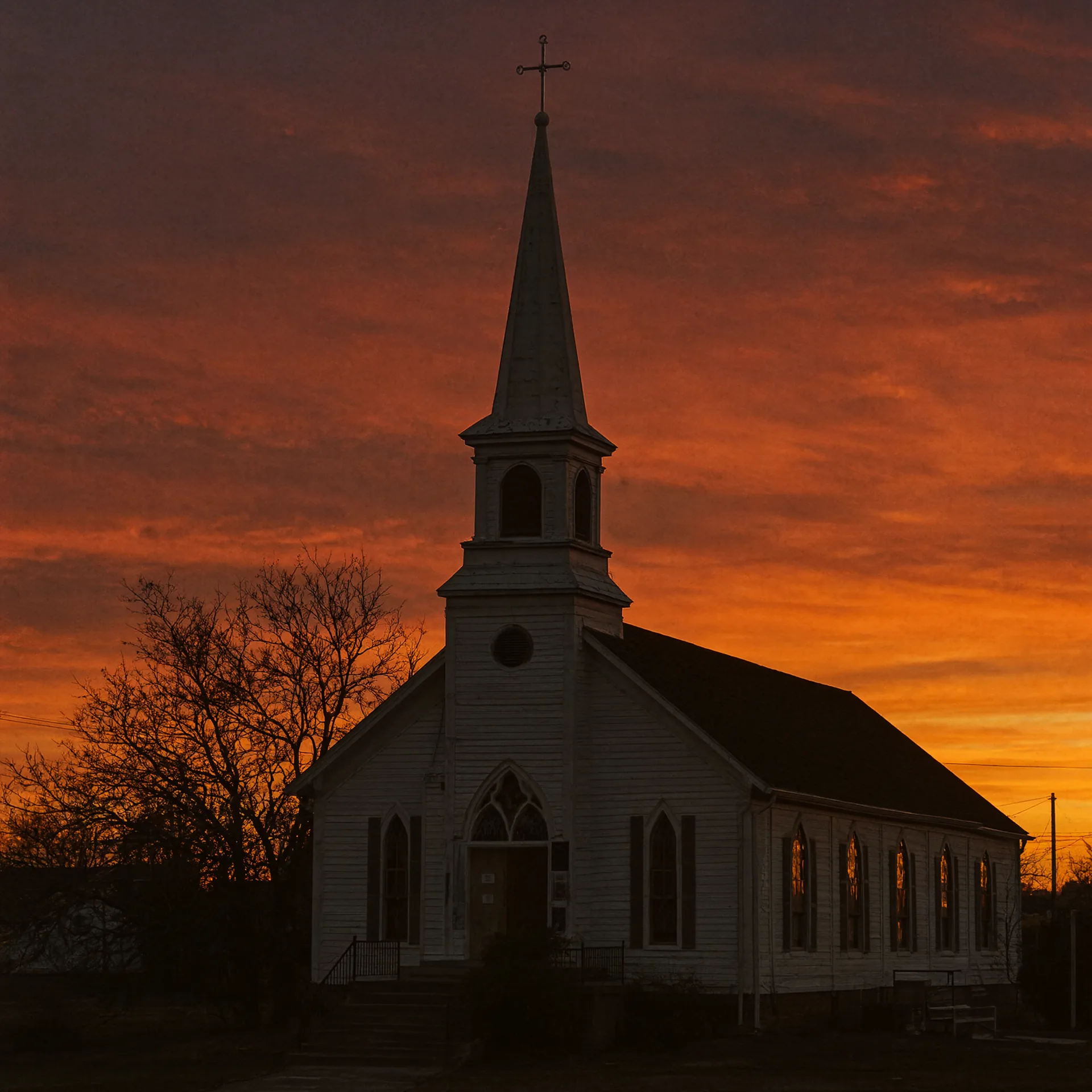 A small town church steeple at twilight